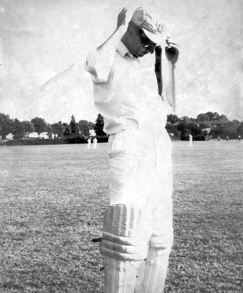 Dave Tickner adjusts his cap before going out to bat at Rose Hill, some time around 1970